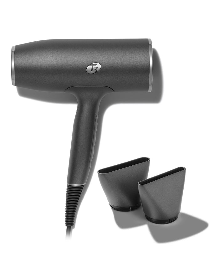 Black hair dryer with two attachments on a white background