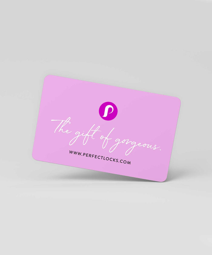 A pink Perfect Locks Gift Card with a white "P" logo, cursive slogan, and website, set on a light gray background.
