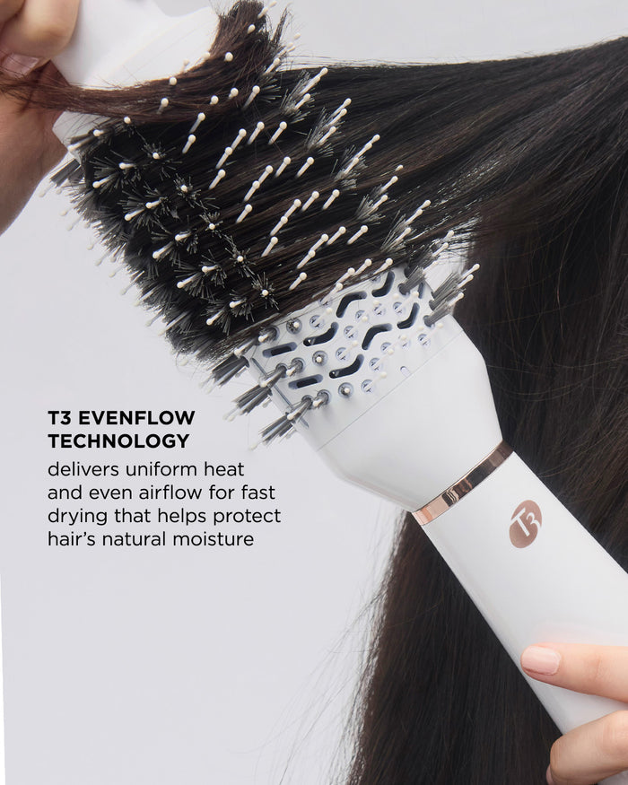 White hairbrush with black bristles being used on dark hair, featuring T3 Evenflow technology text.
