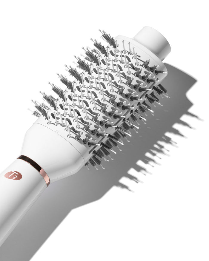 White hairbrush with bristle head on a white background