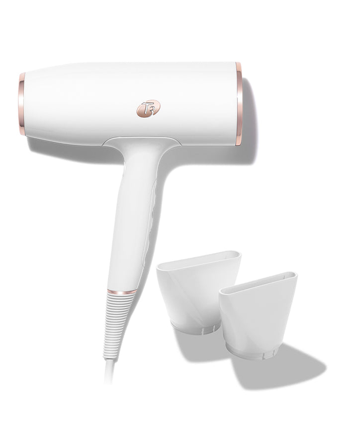 White hair dryer with rose gold accents on a white background