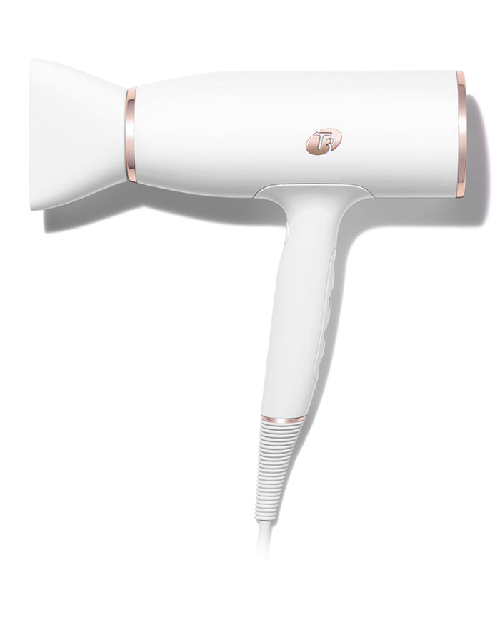 White hair dryer with rose gold accents on a white background