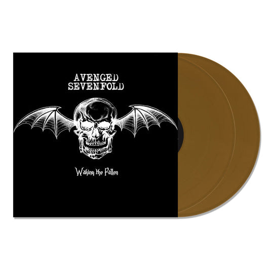 Avenged Sevenfold’s Waking the Fallen 20th Anniversary Gold 2XLP album cover shows a white bat-winged skull on black beside two gold vinyl records, with the bands name above and album title below the skull.