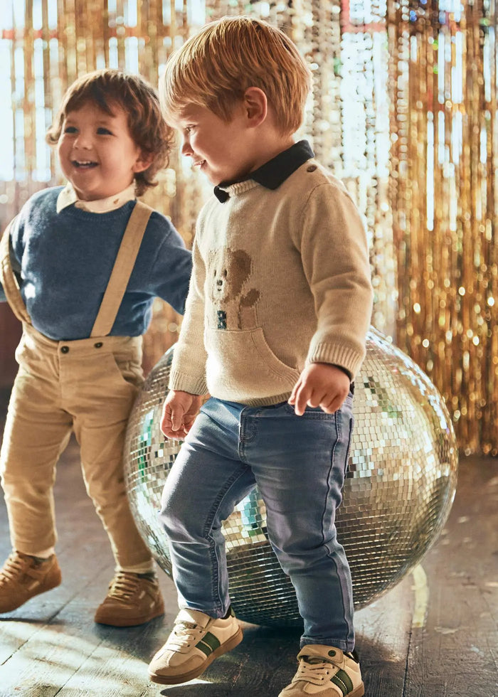Toddler boy wearing Mayoral baby jeans in light-wash blue with adjustable waist; comfy fit for school, photos, and play.