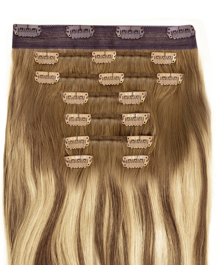 clip-in hair extensions rooted beige highlights.