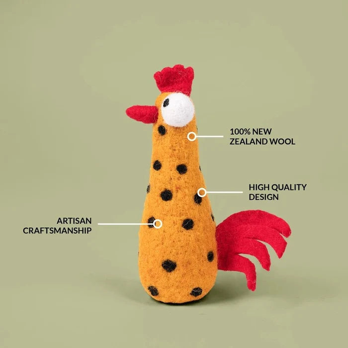 Yellow felted chicken on a green background with features of toy