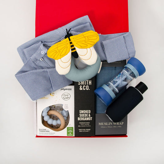 Collection of baby products including a long sleeve romper, bee rattle, teether, muslin wrap hand cream and room spray. $195.00