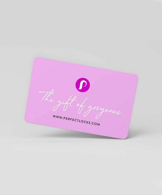 A pink Perfect Locks Gift Card with a white "P" logo, cursive slogan, and website, set on a light gray background.