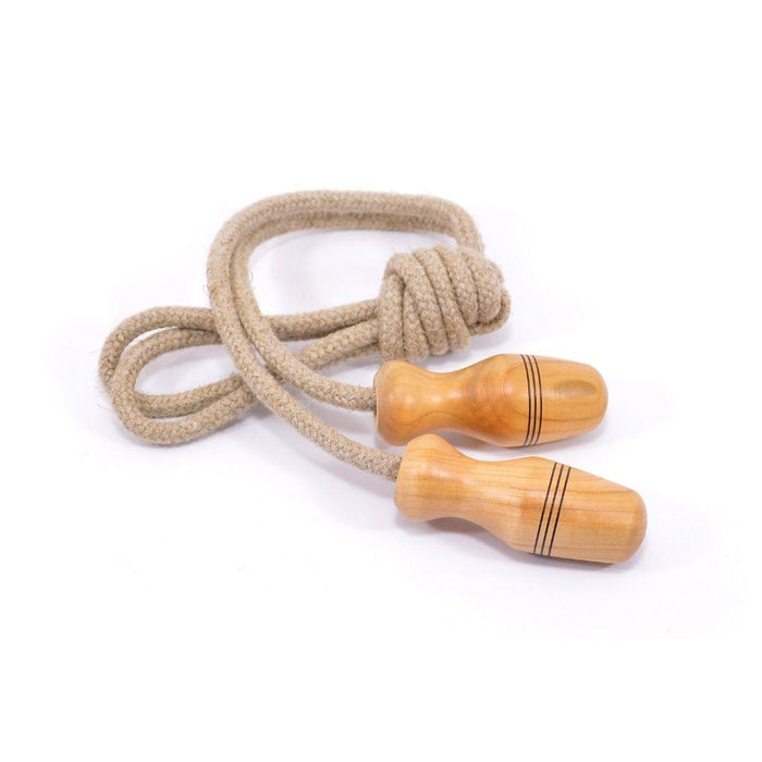 Jump rope with beige rope and wooden handles on a white background
