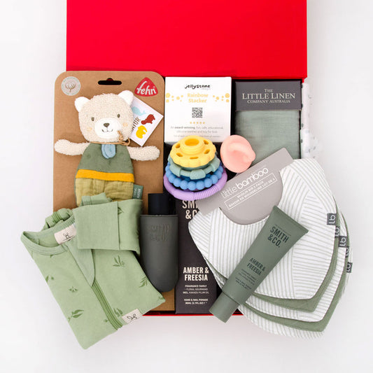 thoughtful gender neutral hamper including romper, crinkle toy, silicone stack toy, muslin wrap, 6 pack bibs, hand cream and room spray. From $195.00
