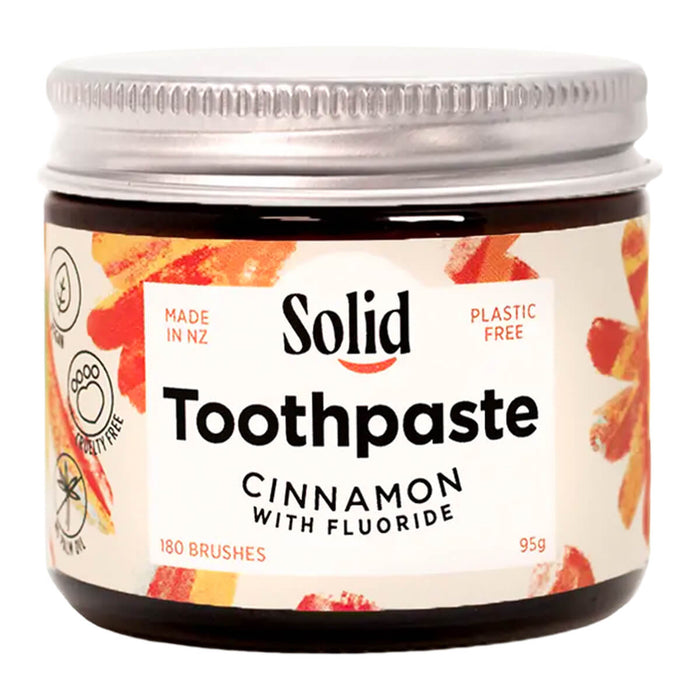 Jar of Solid Toothpaste Cinnamon with Fluoride on a white background