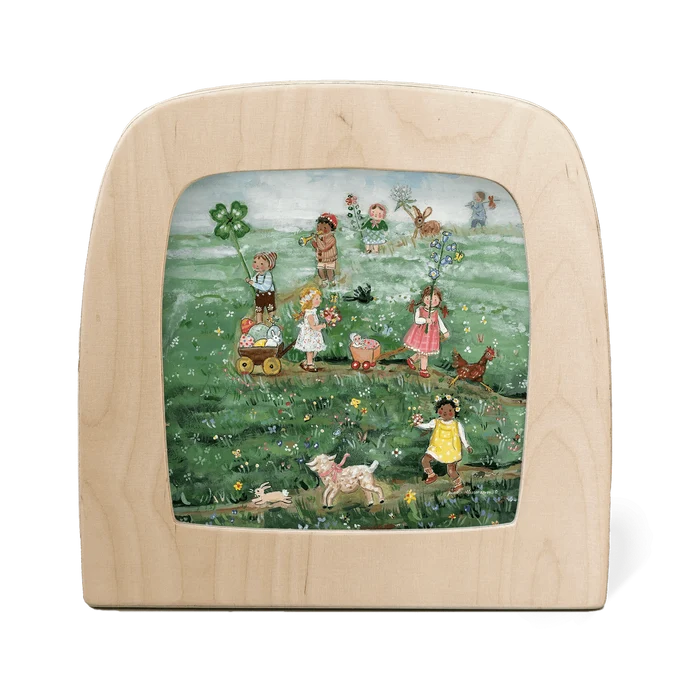 Silhouette of children and animals parading through a grassy meadow