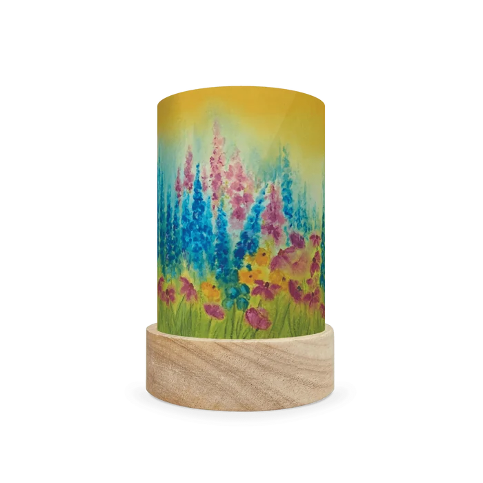 Decorative cylindrical lamp with summery blue and pink floral design on a white background