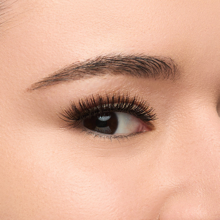 Wing It Mini mini flared lash with full volume and short length, featuring a dense base, tapered ends, and a subtle cat-eye flare.